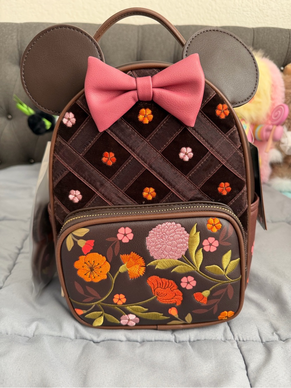 Loungefly Fall Floral Embroidered Brown Backpack with Pink Bow and applique.